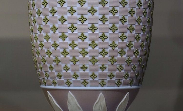 Lavender-grey jasperware urn with applied white relief florets, photographed for identification